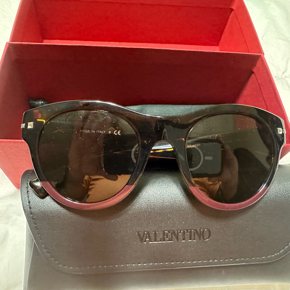 New Valentino and in excellent conditions.  No cracks or breaks or scratches